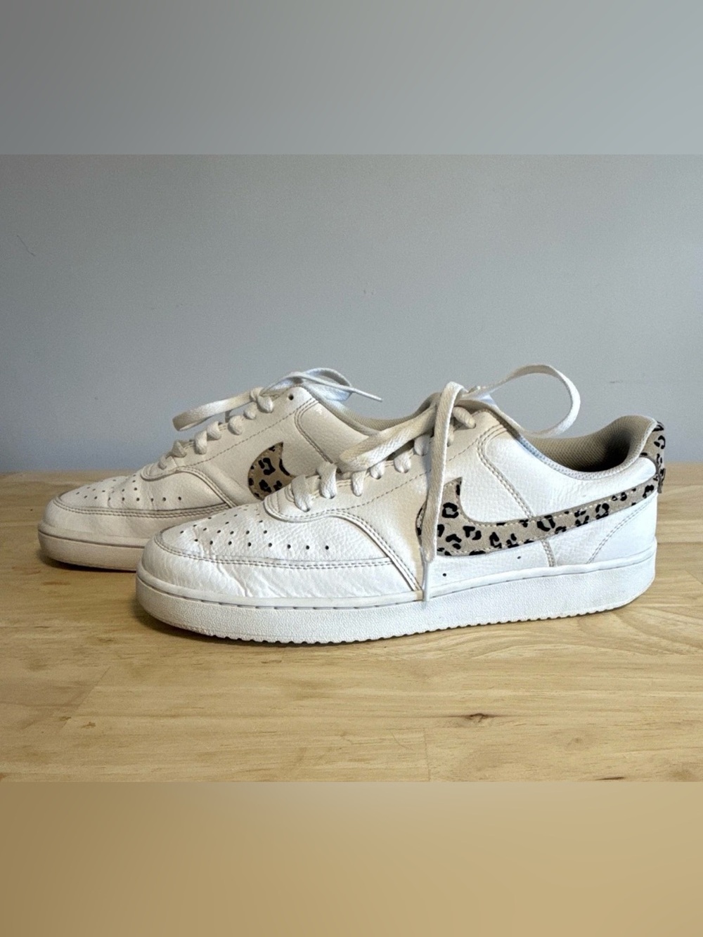 Nike White Low-Top Sneakers with Leopard Swoosh